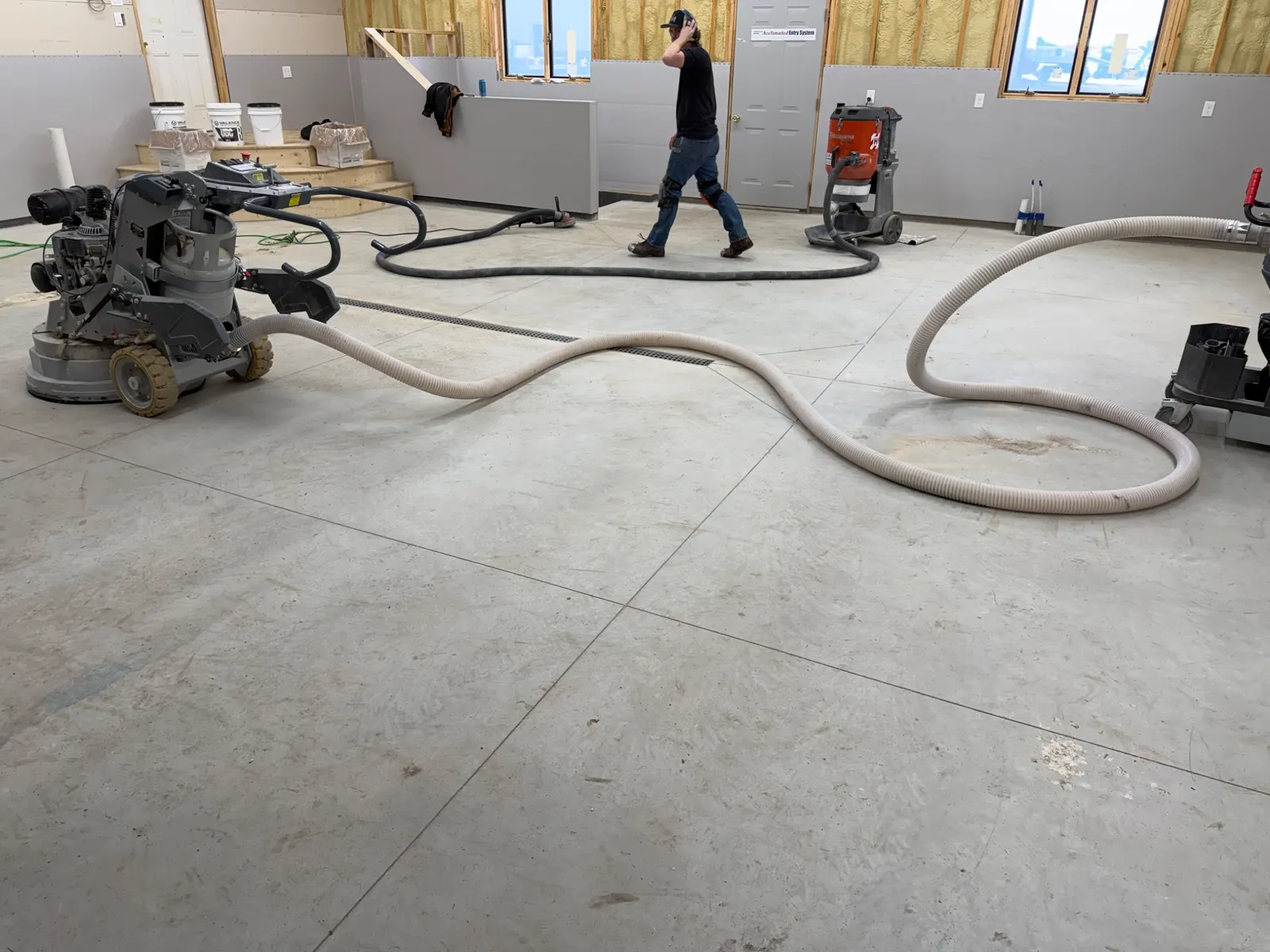 Mechanical concrete surface preparation with professional grinding and dust collection