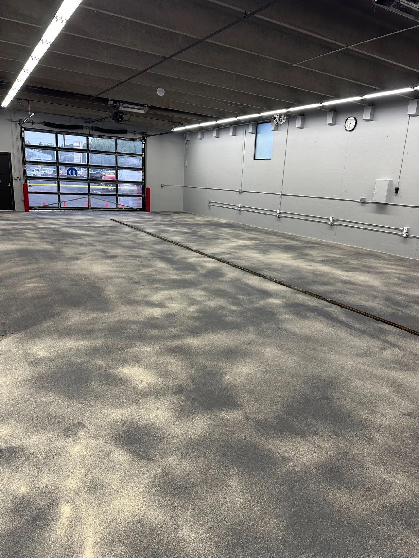 Commercial flooring system during installation on a verified E&M Coatings project